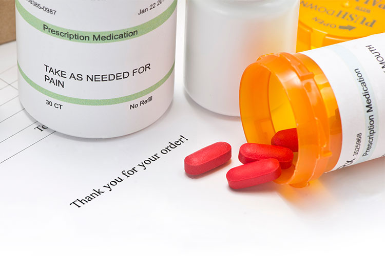 Pill bottle with Mail Order prescription form.